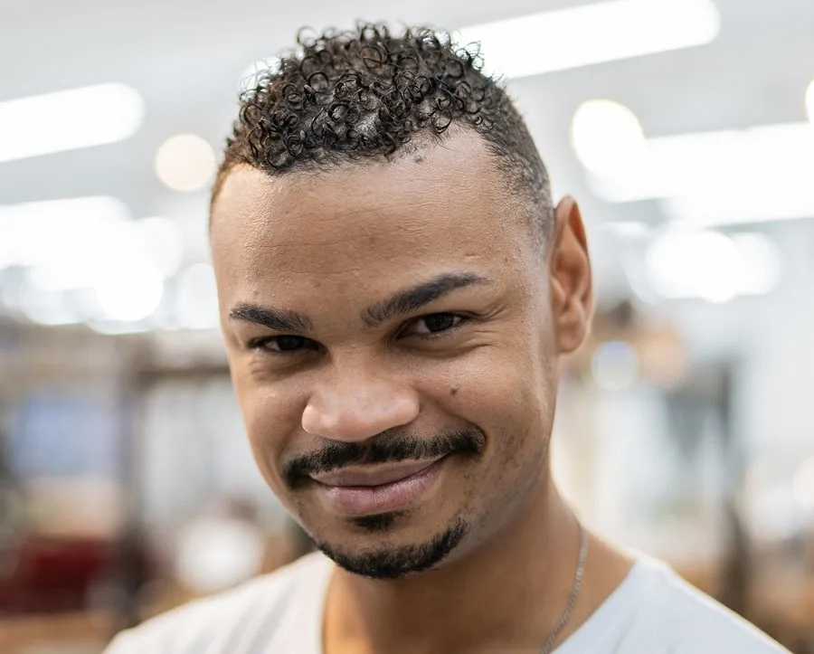 black men mustache with sharp lined goatee