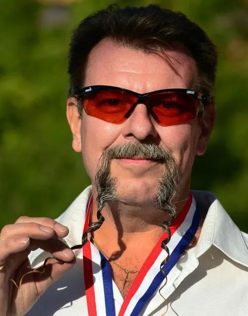 Wojo Wrzesniewski from Toronto, Canada, poses after winning first place in the Fu Manchu Moustache category at the third annual National Beard and Moustache Championships in Las Vegas, Nevada on November 11, 2012. AFP PHOTO / Frederic J. BROWNFREDERIC J. BROWN/AFP/Getty Images ORG XMIT: