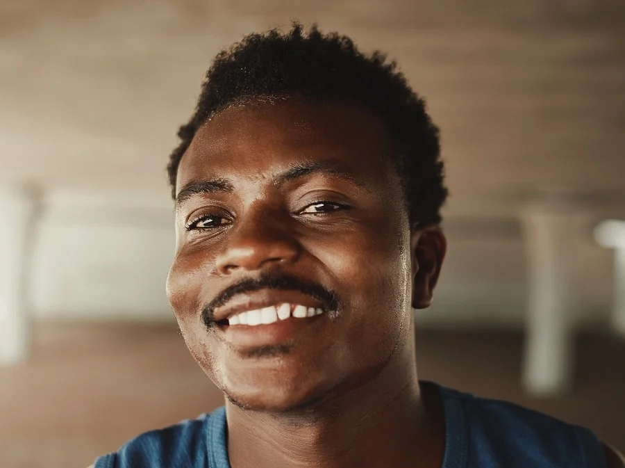 black man with thin lampshade mustache