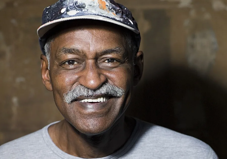 older black man with chevron mustache