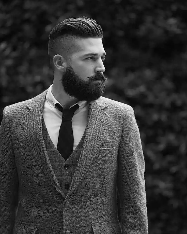 slicked short fade hairstyle with beard