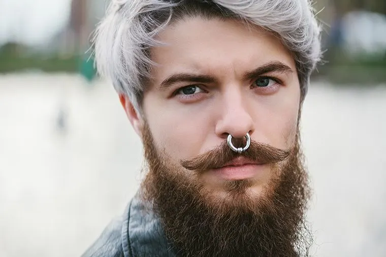 thick beard with pointed mustache