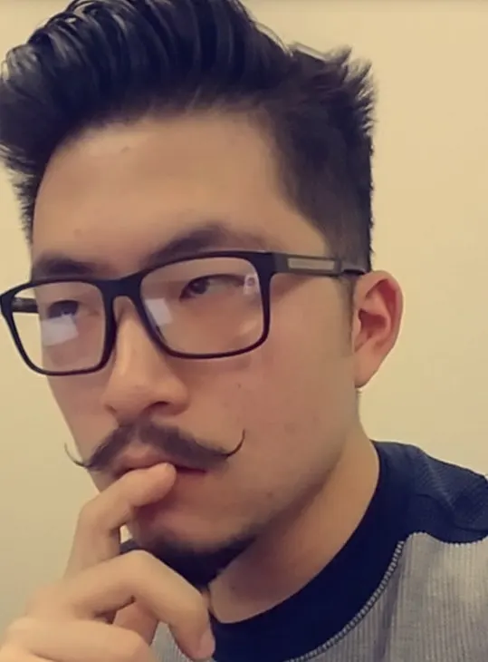 Asian Guy with Thin Handlebar Mustache
