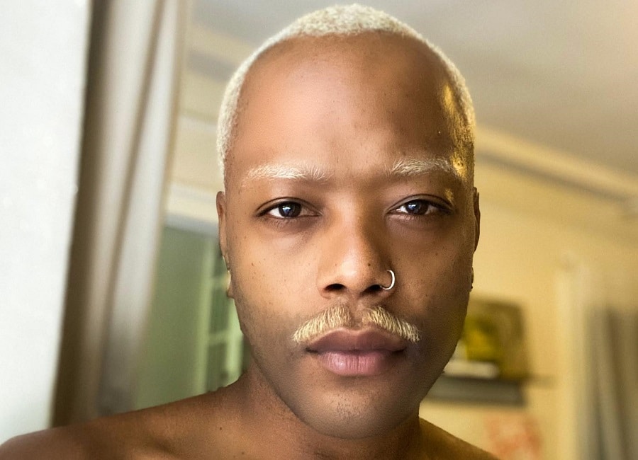 black guy with blonde mustache