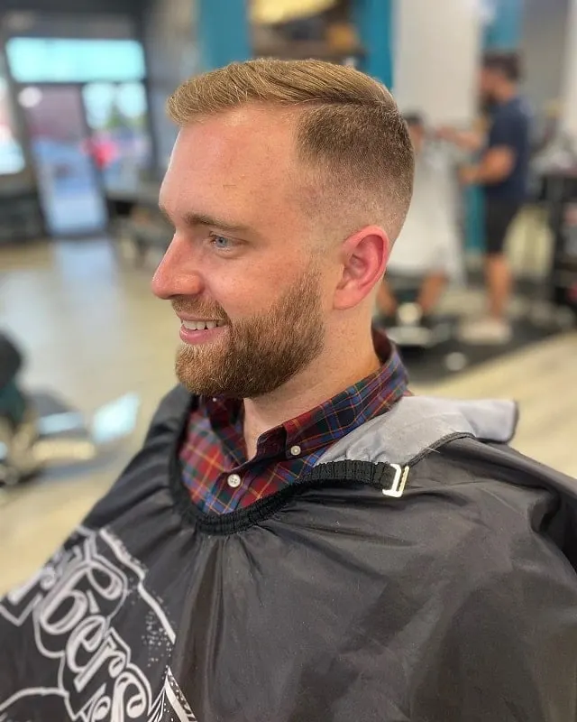 bald fade with part and beard