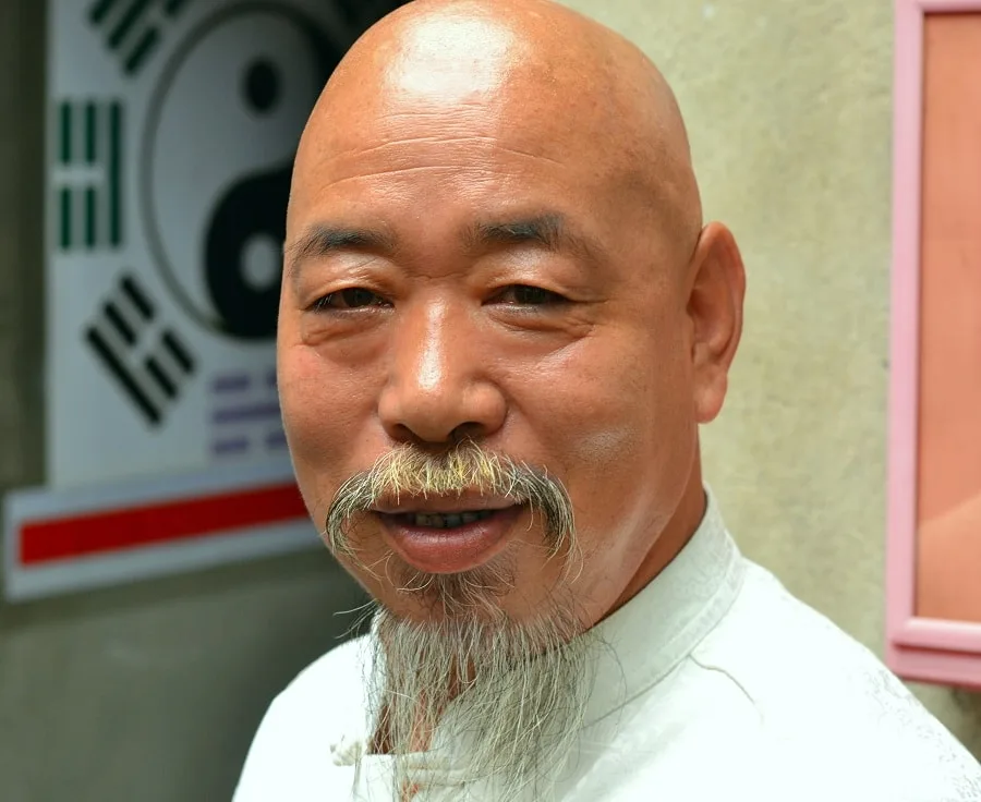 Asian bald man with Fu Manchu beard