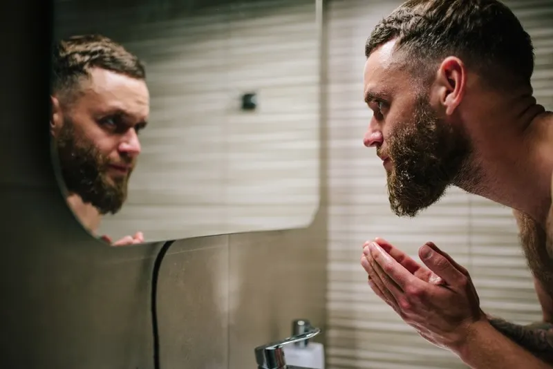 washing beard with warm water
