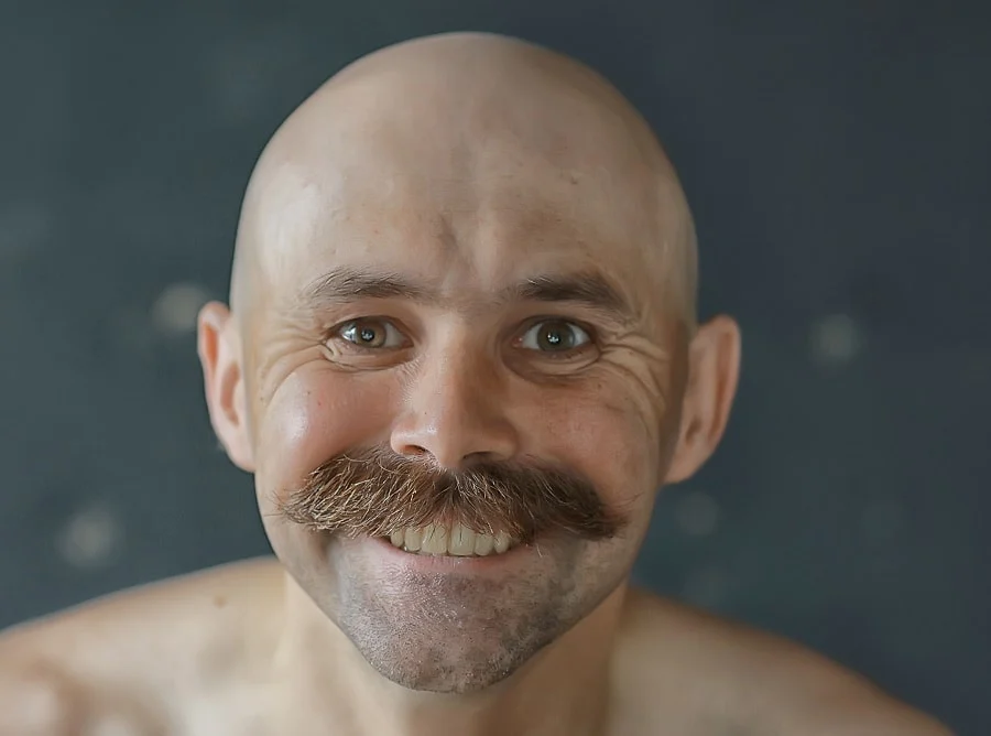 bald guy with walrus mustache
