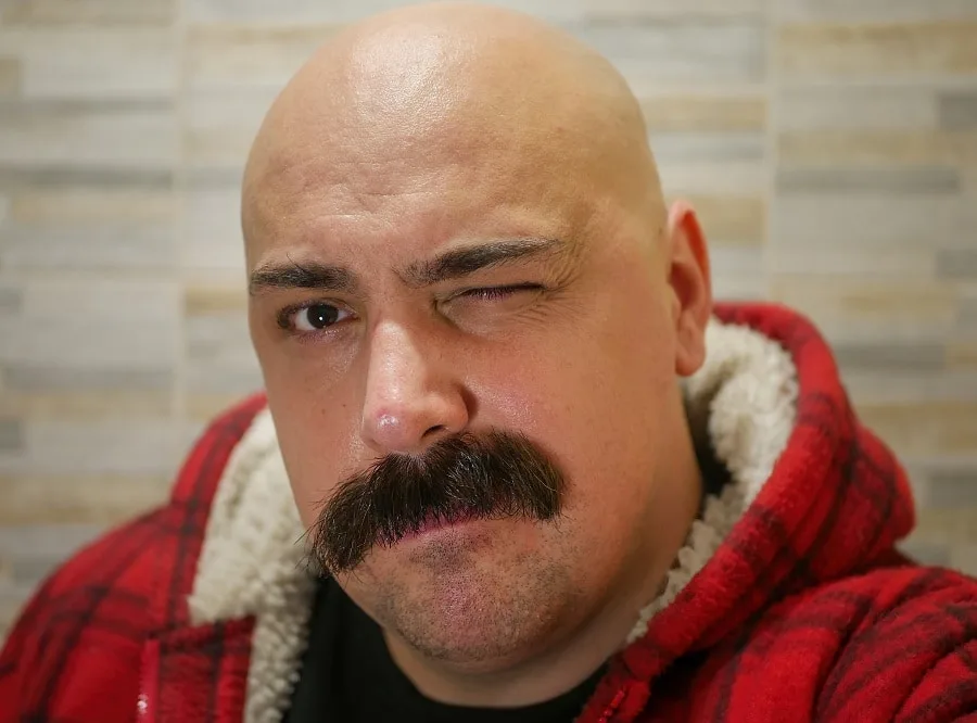 bald guy with walrus mustache