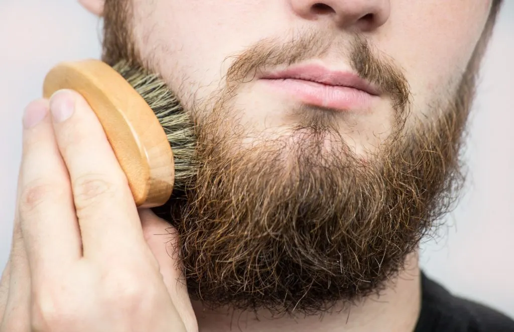 using beard brush