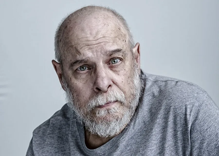 bald man with grey beard