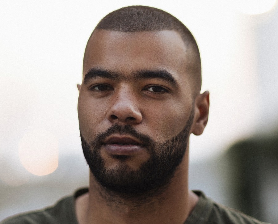 black guy with round face and short beard