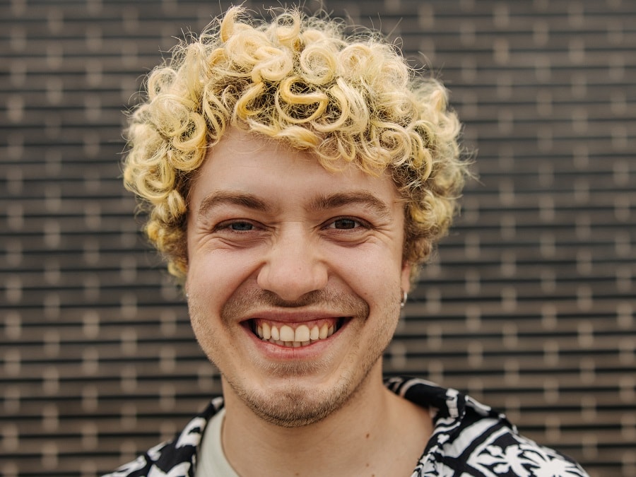 curly blonde hair with light stubble beard
