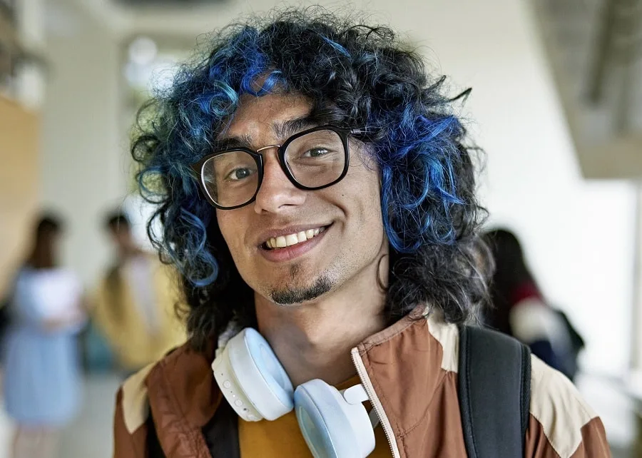 curly hair with blue highlights and soul patch beard