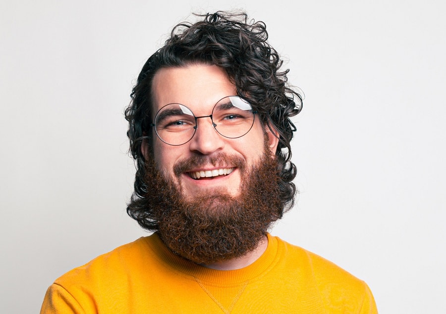 curly hair with bushy beard and glasses