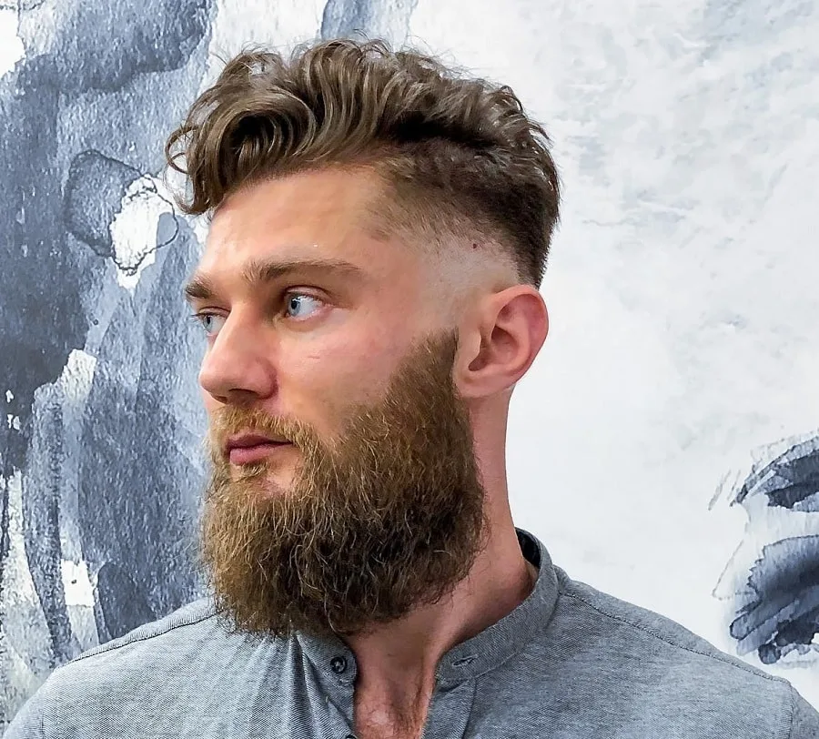 curly pompadour hairstyle with beard