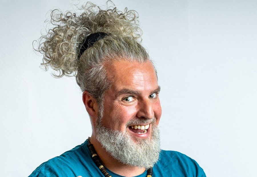 curly topknot for older men with beard