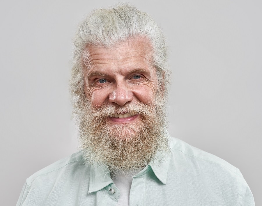 fluffy hairstyle for older men with curly beard