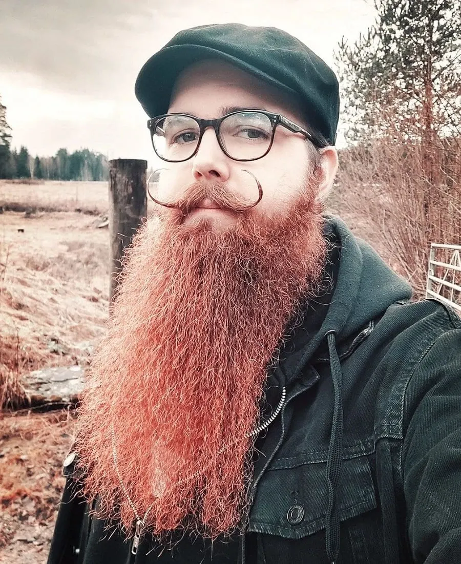 handlebar mustache with long red beard