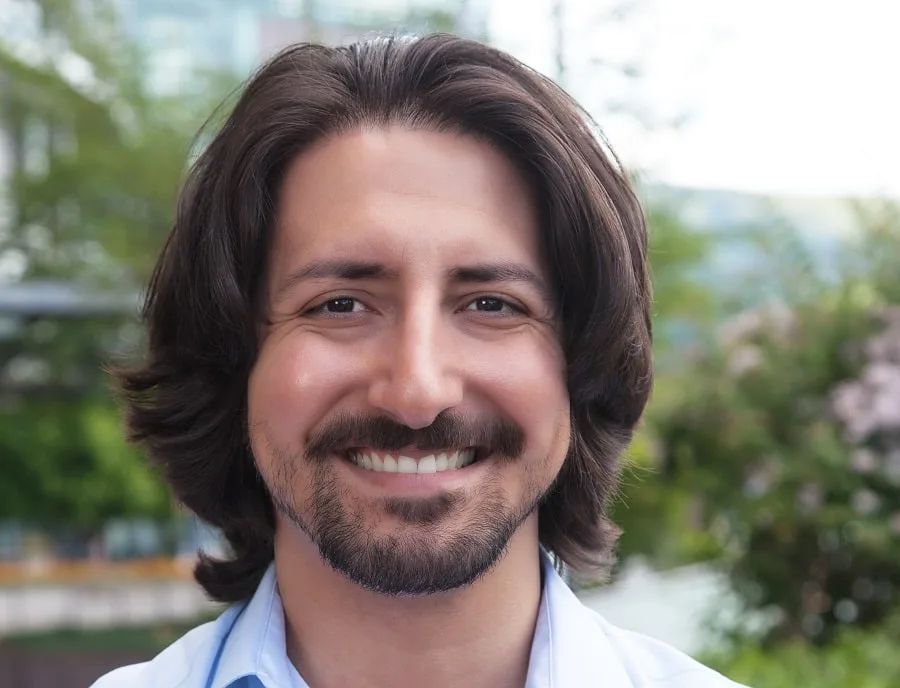 long hair with thick Spanish beard