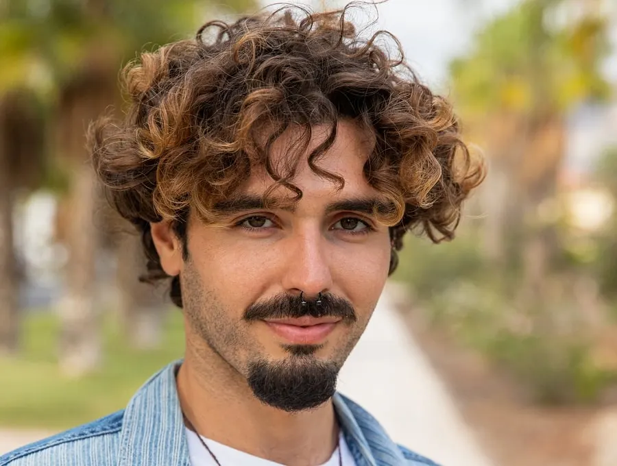 messy curly hair with van dyke beard