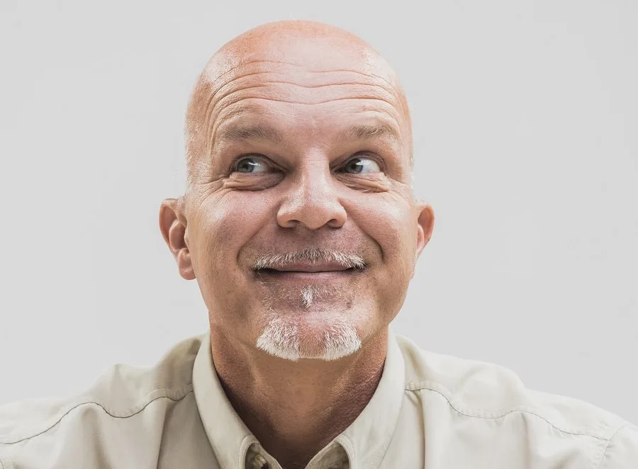 older bald guy with grey chin beard