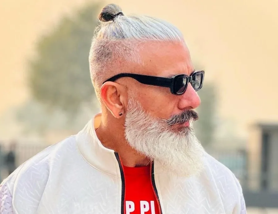 older guy with man bun and beard