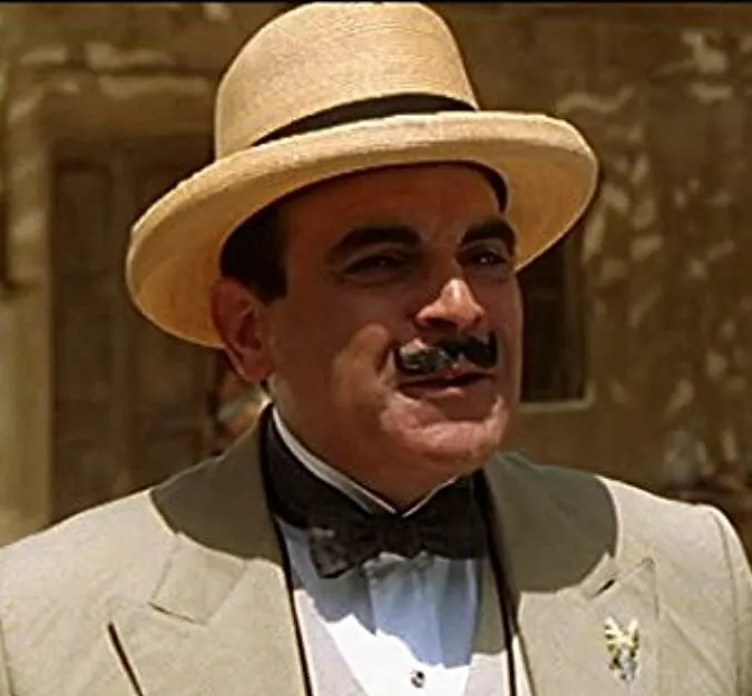 fictional detective character hercule poirot with handlebar mustache