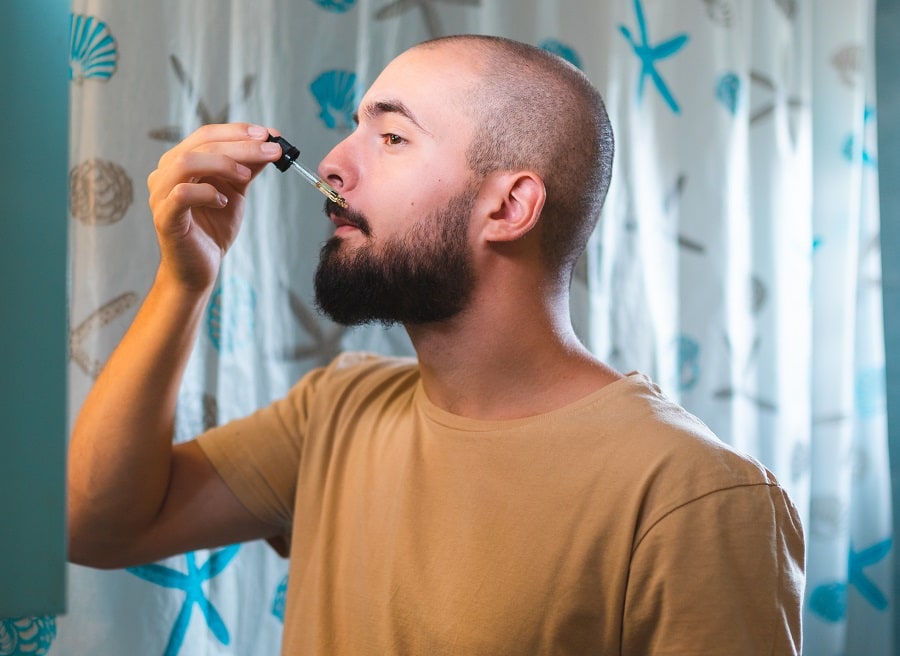 applying essential oil  for faster mustache growth
