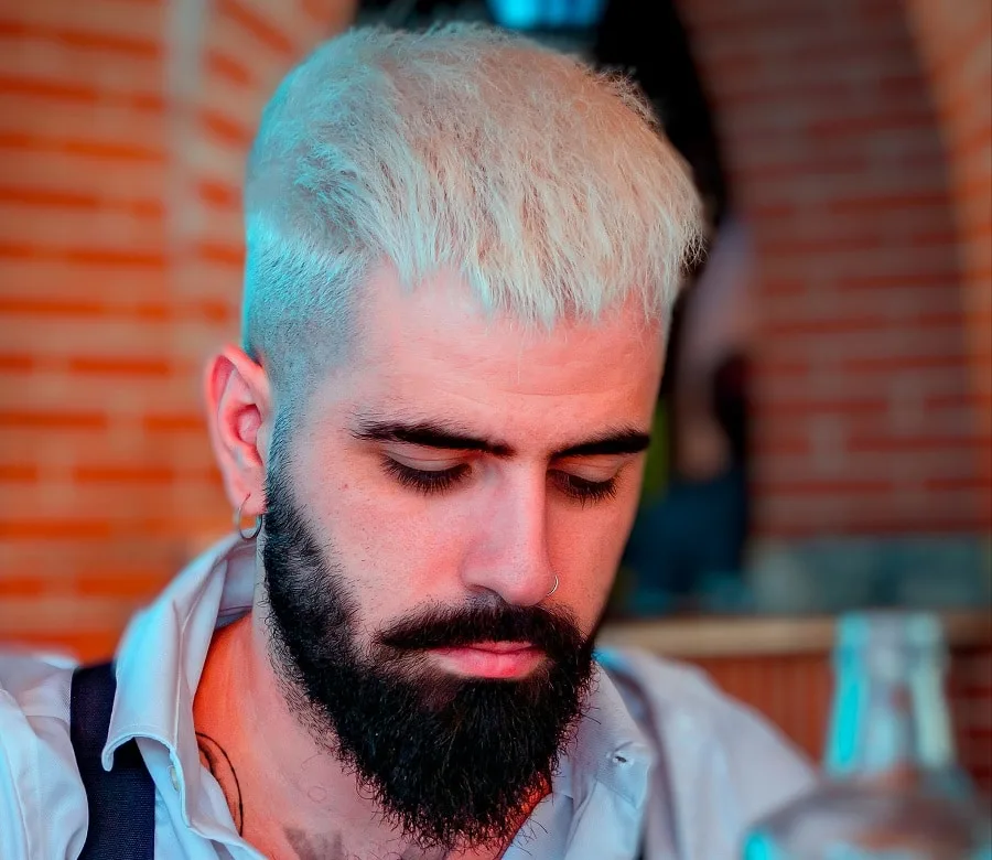 blonde blowout haircut with dark beard