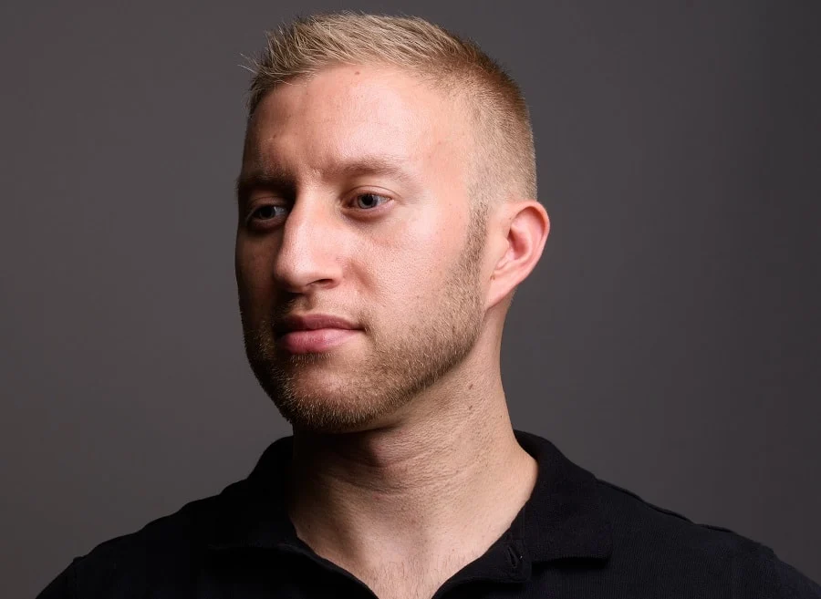 blonde high and tight haircut with light stubble beard