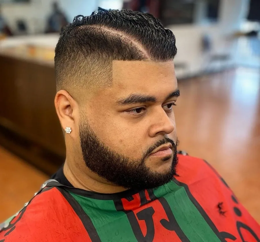 comb over mid fade with beard