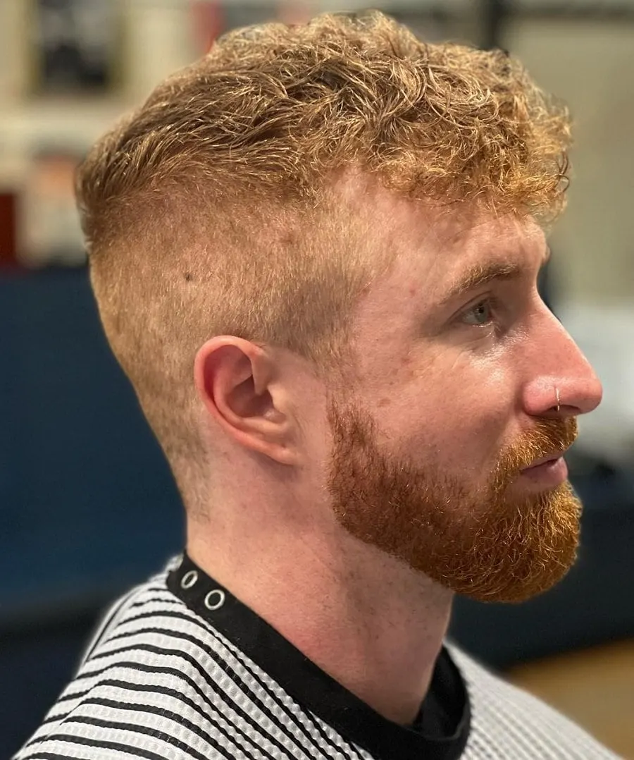 curly high and tight haircut with beard
