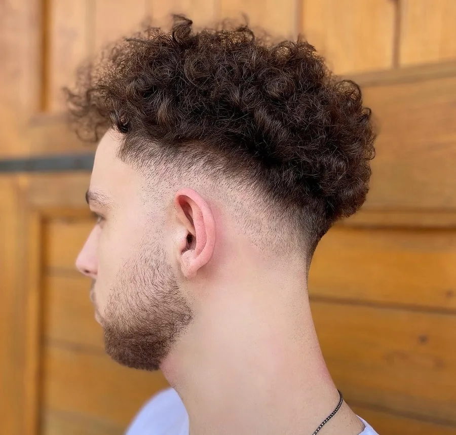 curly mid fade with beard