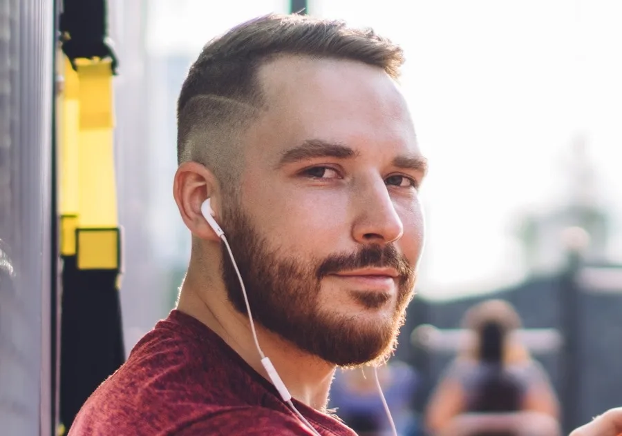 high and tight haircut with hard part and beard