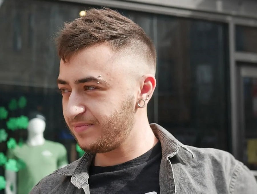 high and tight haircut with light stubble beard