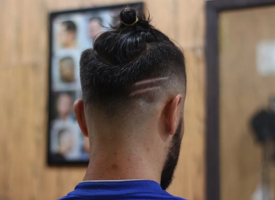 man bun with high fade and beard