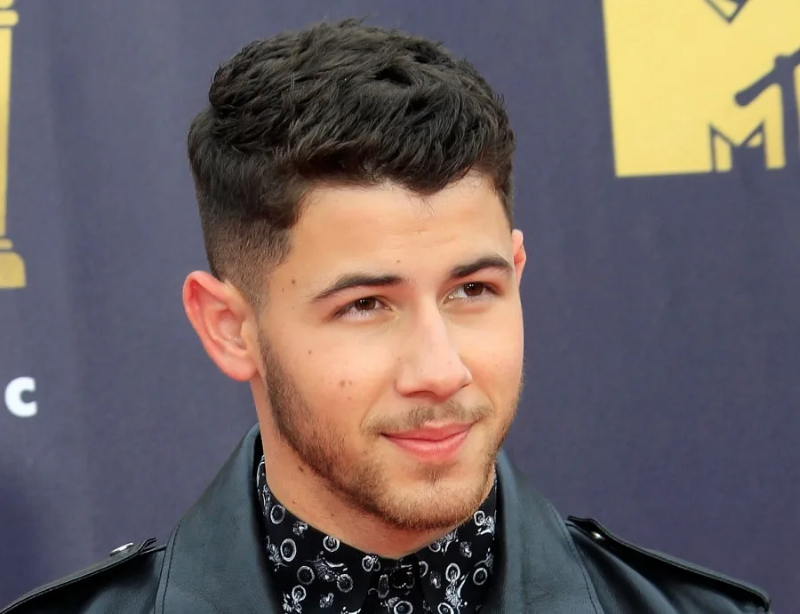 nick jonas long crew cut with light stubble beard