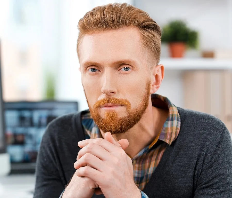 slicked back business hairstyle with red beard