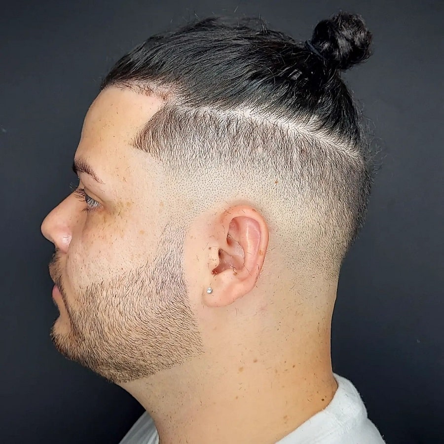 topknot with low skin fade and beard