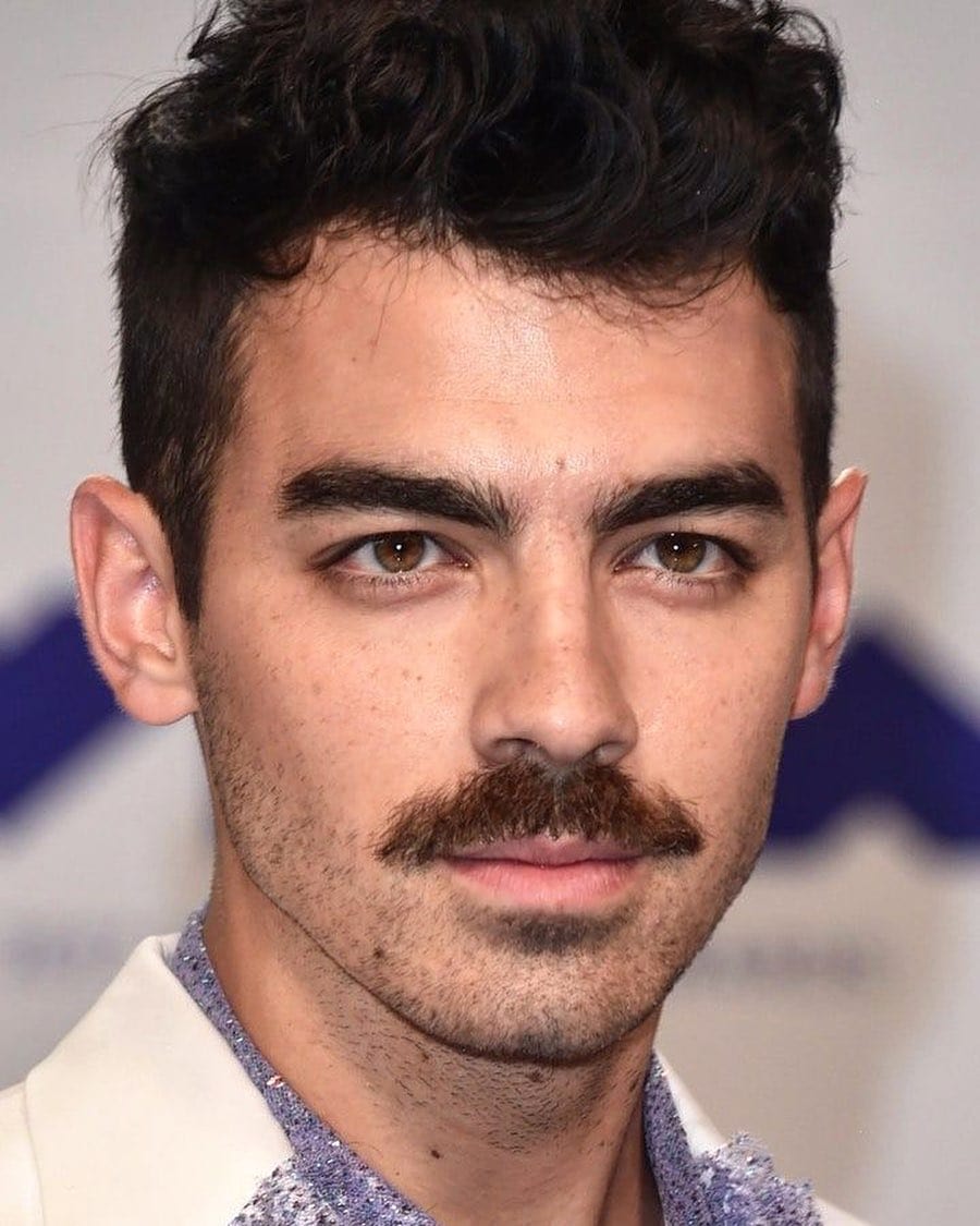 young actor Joe Jonas with thick mustache