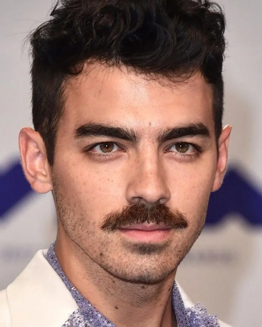 young actor Joe Jonas with thick mustache