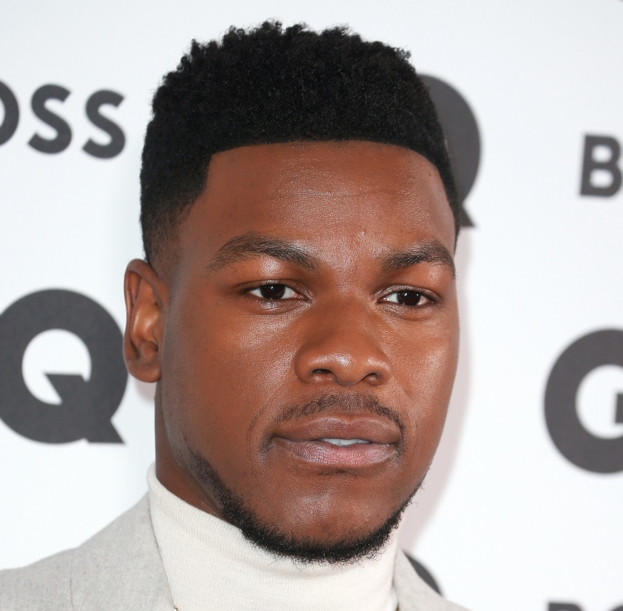 young actor John Boyega with thin mustache