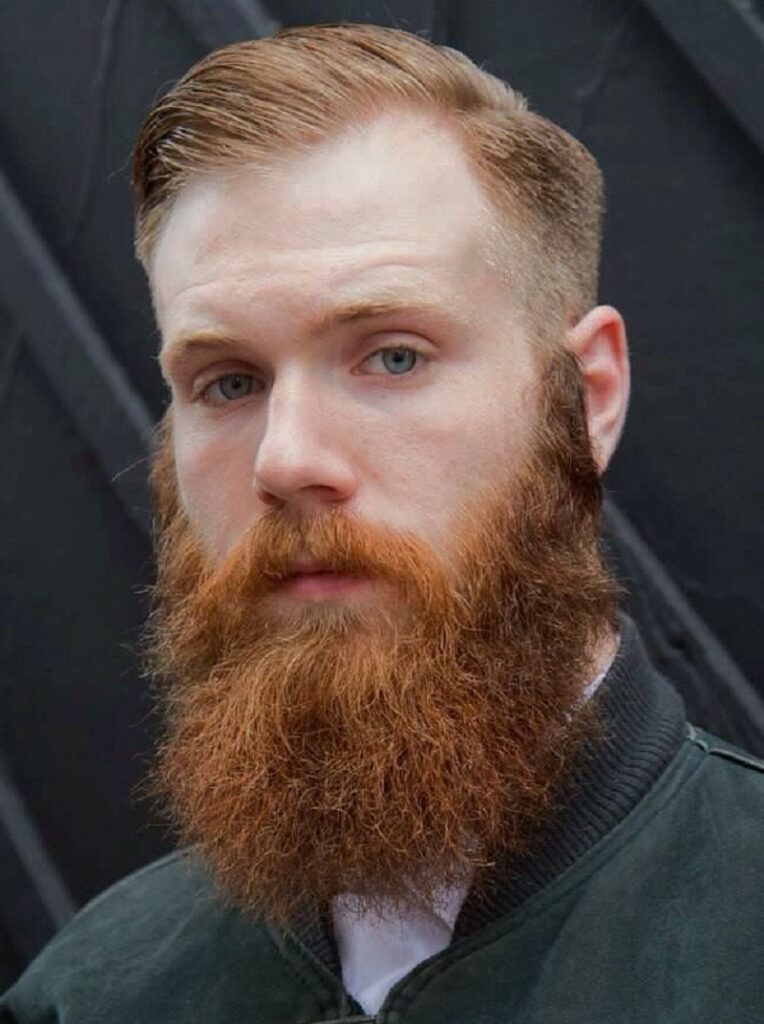 blonde side part with bright red beard