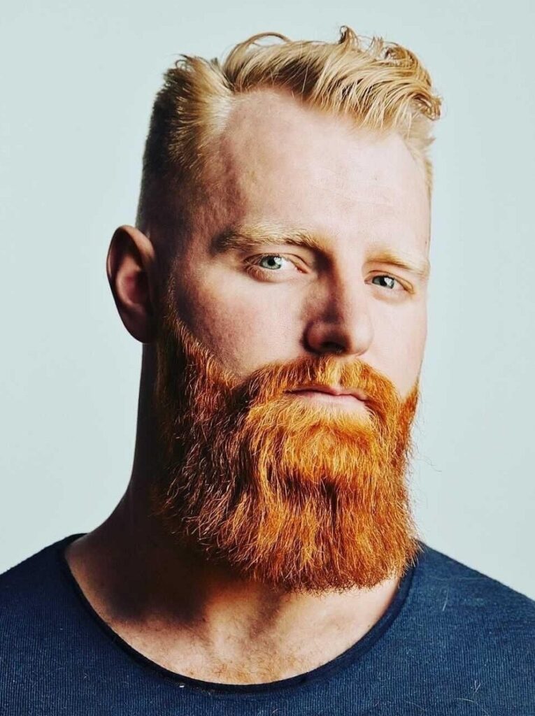 blonde wavy hair with red square beard