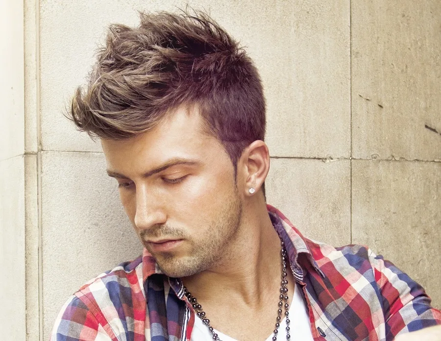 crisp faux hawk with light stubble beard