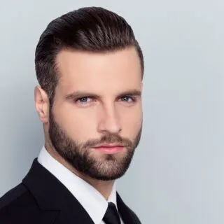 slicked back hairstyle with beard
