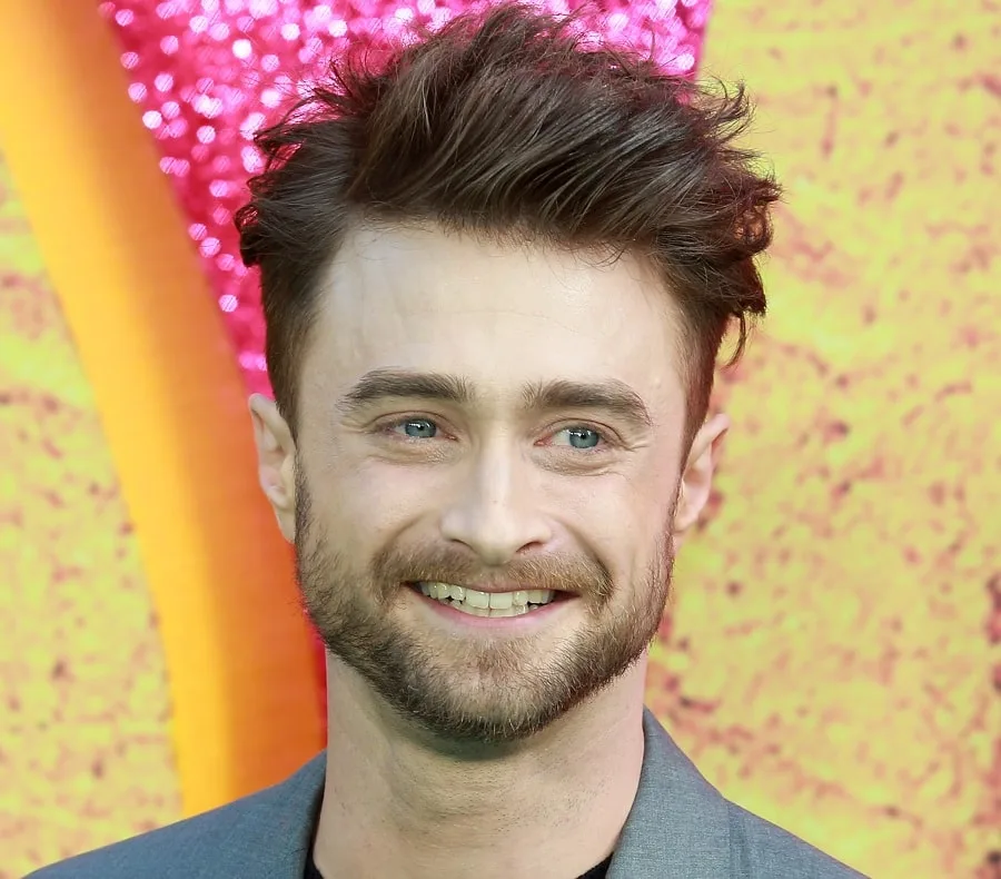 young actor Daniel Radcliffe with heavy stubble beard