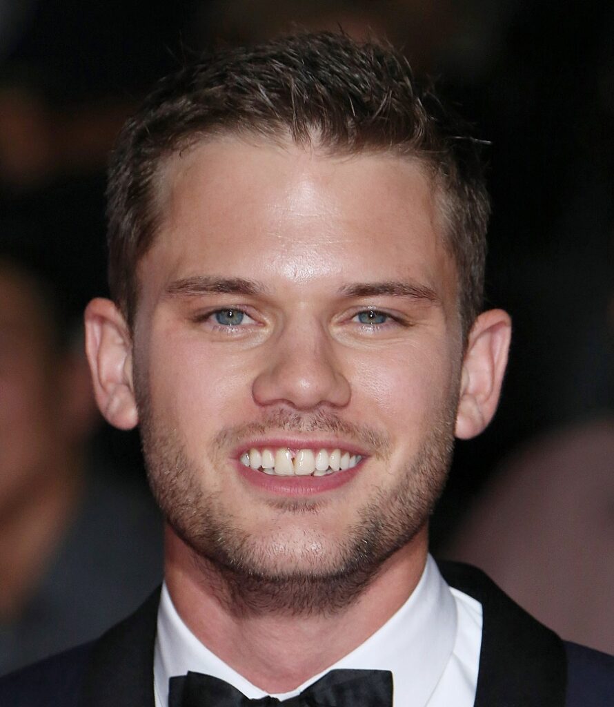 young actor Jeremy Irvine with patchy stubble beard