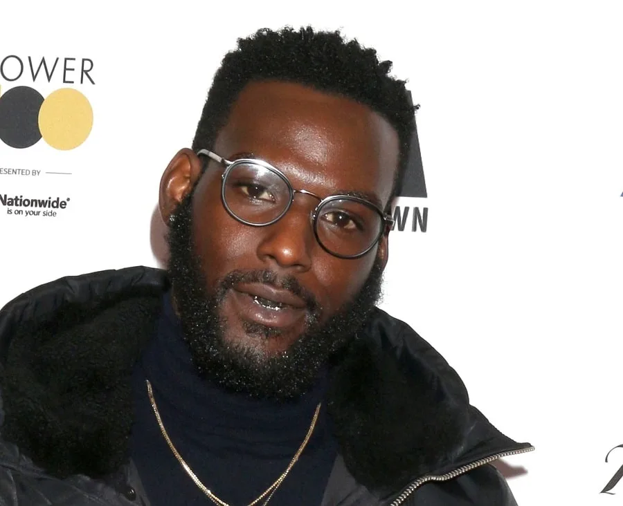 young actor Kofi Siriboe with curly beard